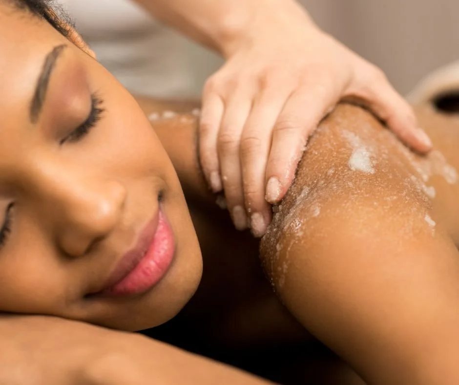 Client receiving a body polish treatment